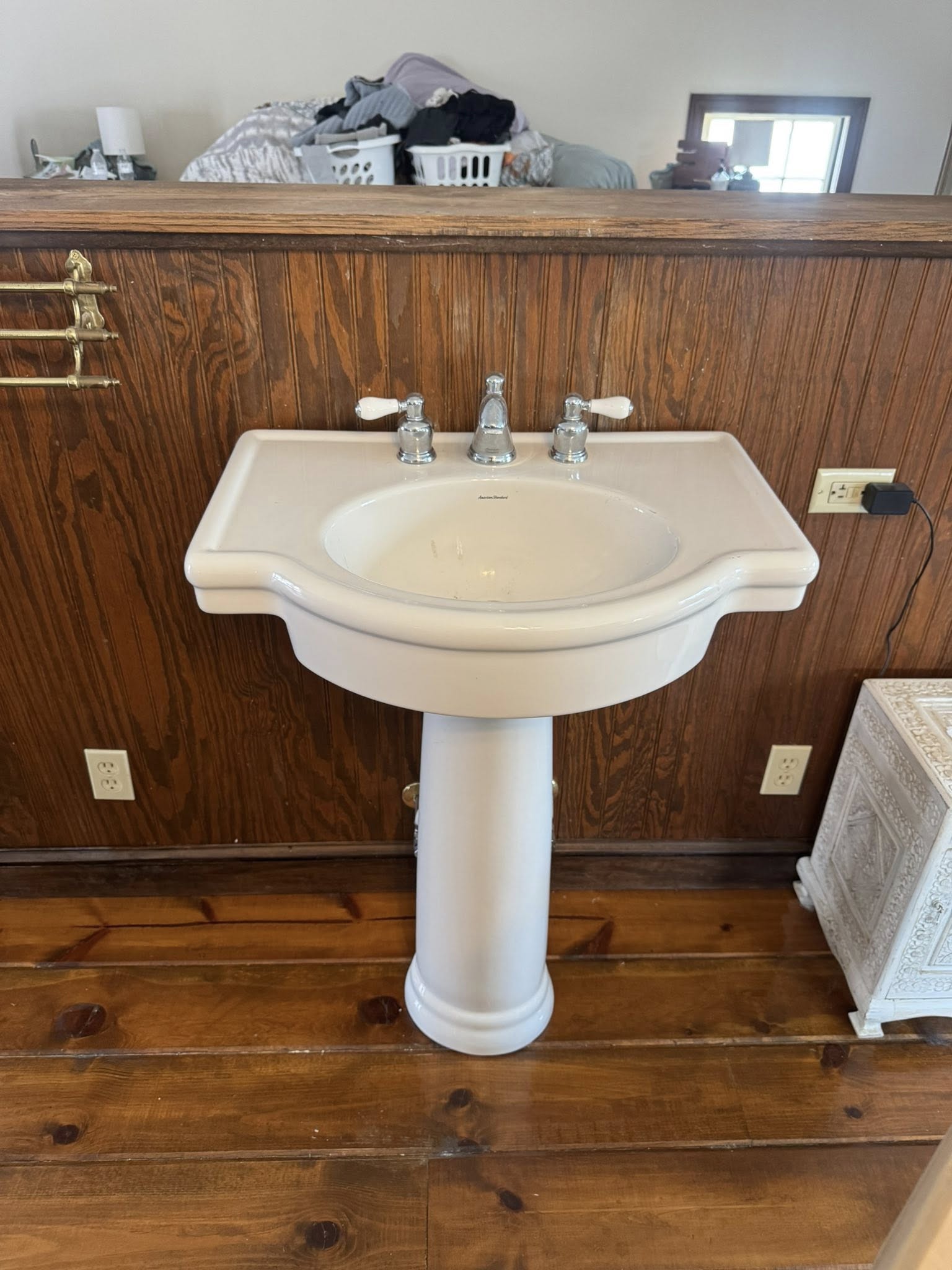 Old pedestal sink before replacement